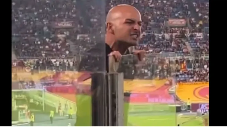 AC Milan fan yelling at Roma supporters.