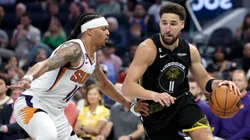 Klay Thompson #11 of the Golden State Warriors is guarded by Damion Lee #10 of the Phoenix Suns