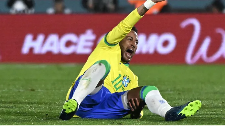 Neymar Jr. of Brazil reacts after being injured in the match against Uruguay