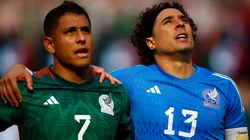 Luis Romo #7 and Guillermo Ochoa #13 of Mexico