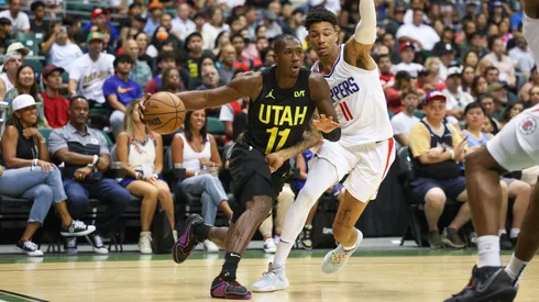 Kris Dunn #11 of the Utah Jazz drives against Joshua Primo #12 of the Los Angeles Clippers