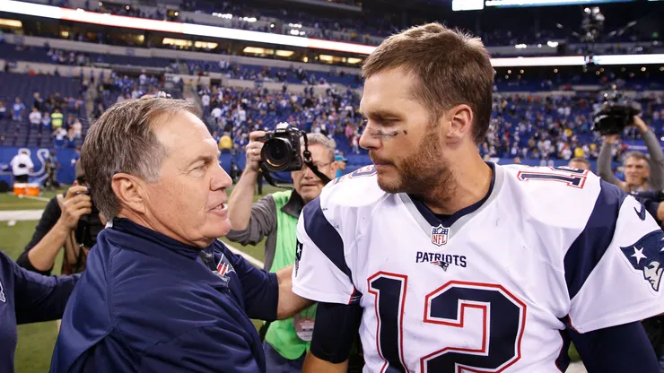 Bill Belichick and Tom Brady shake hands after a Patriots game.