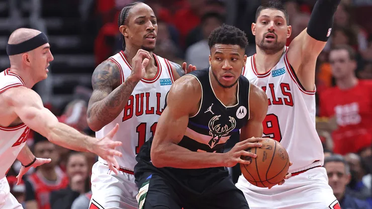 Giannis Antetokounmpo #34 of the Milwaukee Bucks looks to move against (L-R) Alex Caruso #6, DeMar DeRozan #11 and Nikola Vucevic #9 of the Chicago Bulls