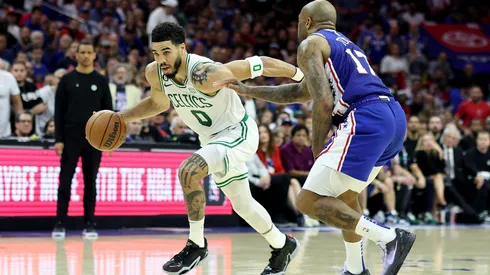 Jayson Tatum #0 of the Boston Celtics drives to the basket against P.J. Tucker #17 of the Philadelphia 76ers