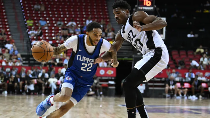 Xavier Moon #22 of LA Clippers dribbles past Ochai Agbaji #30 of Utah Jazz