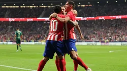 Angel Correa of Atletico Madrid celebrates with teammates