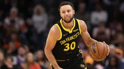 Stephen Curry dribbling the basketball.