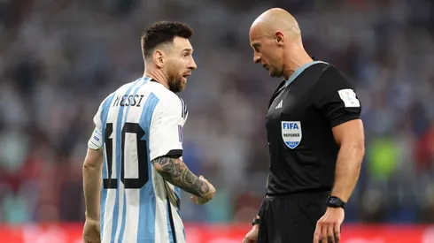 Lionel Messi of Argentina speaks to Referee Szymon Marciniak during the FIFA World Cup Qatar 2022.