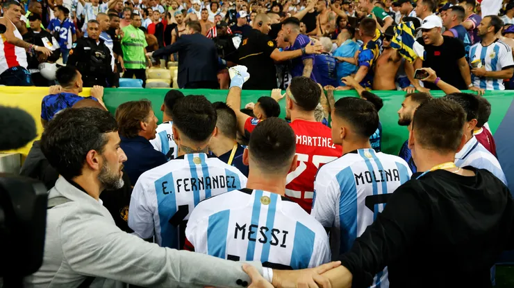 Lionel Messi trying to calm down the situation at Maracana Stadium.