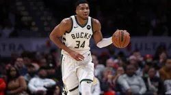 Giannis Antetokounmpo dribbling the basketball.