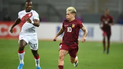 Luis Advíncula of Peru competes for the ball with Yeferson Soteldo of Venezuela.
