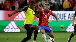Felix Torres Caicedo of Ecuador and Eduardo Vargas of Chile fight for the ball.
