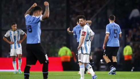 Lionel Messi of Argentina looks dejected as players of Uruguay celebrate.