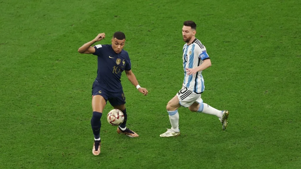 Kylian Mbappe controls the ball against Lionel Messi during the FIFA World Cup Qatar 2022 Final match between Argentina and France at Lusail Stadium on December 18, 2022 in Lusail City, Qatar.