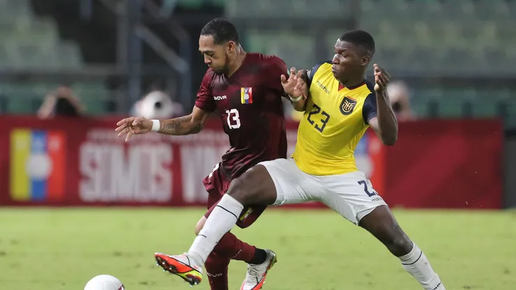 Jose Martinez of Venezuela and Moises Caicedo of Ecuador fight for the ball during a match in 2021.