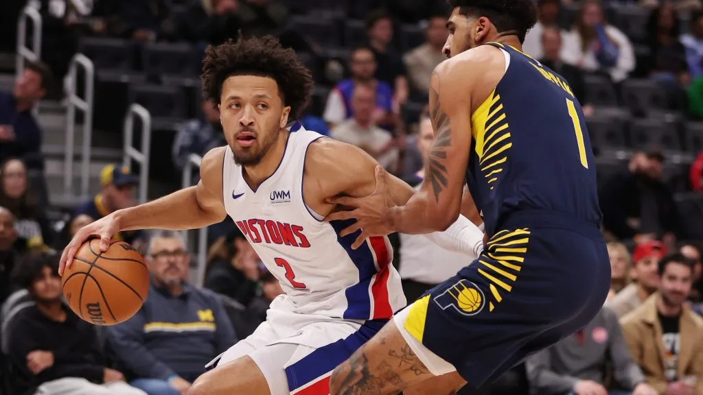 DETROIT, MICHIGAN – DECEMBER 11: Cade Cunningham #2 of the Detroit Pistons tries to drive around Obi Toppin #1 of the Indiana Pacers during the first half at Little Caesars Arena on December 11, 2023 in Detroit, Michigan. (Photo by Gregory Shamus/Getty Images)
