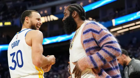 James Harden talks to Stephen Curry on March 24, 2023 in San Francisco, California.