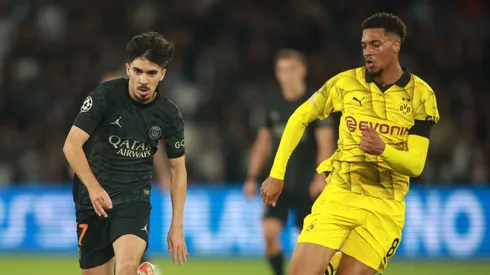 Vitinha (L) of Paris Saint-Germain under pressure by Felix Nmecha of Dortmund during the UEFA Champions League Group F match between Paris Saint-Germain and Borussia Dortmund at Parc des Princes on September 19, 2023 in Paris, France.