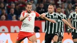 Harry Kane of Bayern Munich is challenged by Christian Eriksen of Manchester United during the UEFA Champions League match between FC Bayern München and Manchester United at Allianz Arena on September 20, 2023 in Munich, Germany.