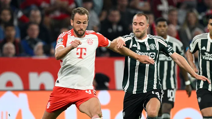 Harry Kane of Bayern Munich is challenged by Christian Eriksen of Manchester United during the UEFA Champions League match between FC Bayern München and Manchester United at Allianz Arena on September 20, 2023 in Munich, Germany.
