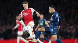 Martin Oedegaard of Arsenal and Sergino Dest of PSV Eindhoven battle for possession.