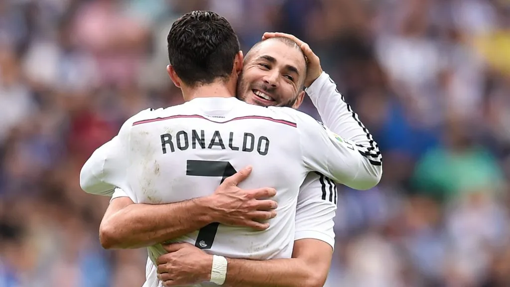 Cristiano Ronaldo of Real Madrid CF celebrates with his teammate Karim Benzema of Real Madrid CF after scoring his team's third goalduring the La Liga match between RC Deportivo La Coruna and Real Madrid CF at Riazor Stadium on September 20, 2014 in La Coruna, Spain.