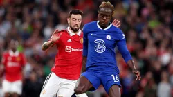 Trevoh Chalobah of Chelsea battles for possession with Bruno Fernandes of Manchester United during the Premier League match between Manchester United and Chelsea FC at Old Trafford on May 25, 2023 in Manchester, England.