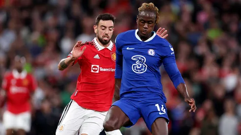 Trevoh Chalobah of Chelsea battles for possession with Bruno Fernandes of Manchester United during the Premier League match between Manchester United and Chelsea FC at Old Trafford on May 25, 2023 in Manchester, England.