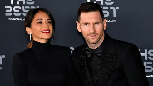 Antonela Roccuzzo and Lionel Messi pose for a photo on the Green Carpet ahead of The Best FIFA Football Awards 2022 on February 27, 2023 in Paris, France.