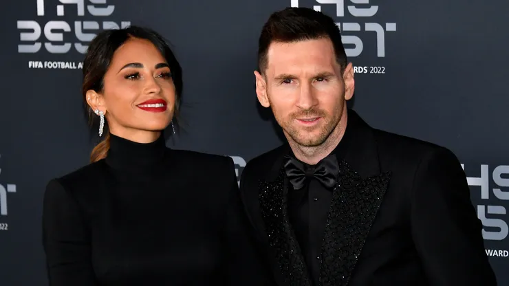 Antonela Roccuzzo and Lionel Messi pose for a photo on the Green Carpet ahead of The Best FIFA Football Awards 2022 on February 27, 2023 in Paris, France.
