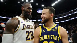 LeBron James (left) and Stephen Curry laughing after a game.