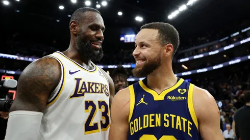 LeBron James (left) and Stephen Curry laughing after a game.
