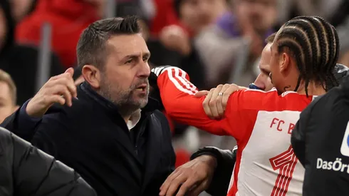 Nenad Bjelica, Head Coach of 1.FC Union Berlin, and Leroy Sane of Bayern Munich clash during the Bundesliga match between FC Bayern München and 1. FC Union Berlin at Allianz Arena on January 24, 2024 in Munich, Germany.