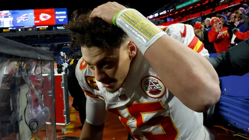 Patrick Mahomes #15 of the Kansas City Chiefs dodges snowballs thrown by fans after defeating the Buffalo Bills in the AFC Divisional Playoff game at Highmark Stadium on January 21, 2024 in Orchard Park, New York.