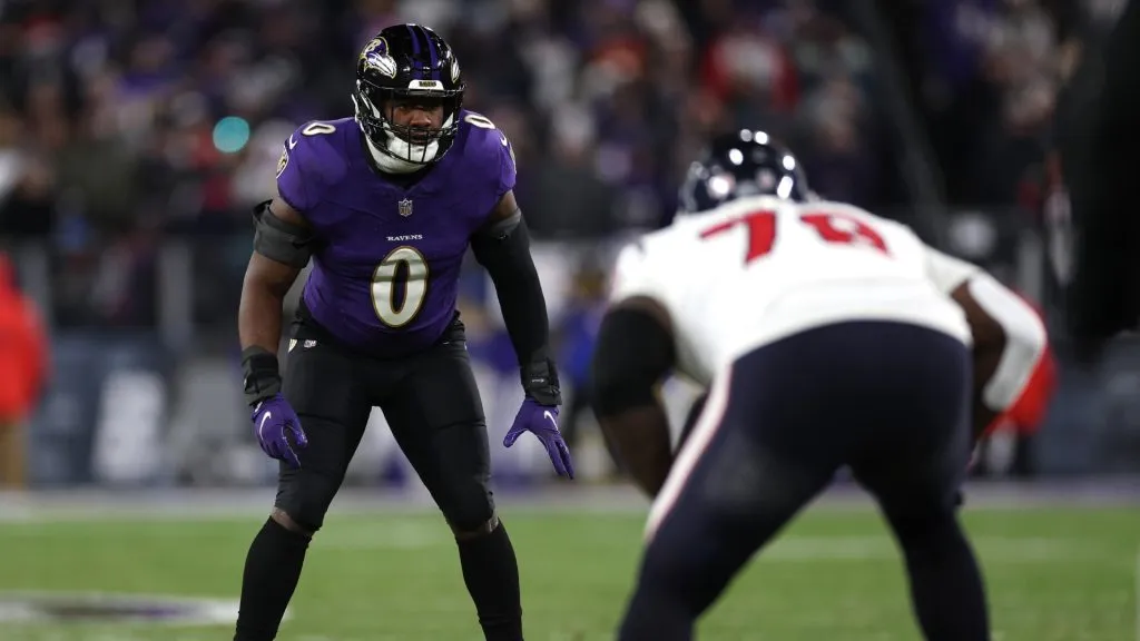 Linebacker Roquan Smith #0 of the Baltimore Ravens in action against the Houston Texans in the AFC Divisional Playoff game at M&amp;T Bank Stadium on January 20, 2024 in Baltimore, Maryland.