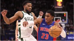 Jaden Ivey #23 of the Detroit Pistons drives around Malik Beasley #5 of the Milwaukee Bucks