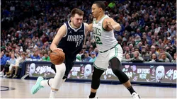Luka Doncic #77 of the Dallas Mavericks drives to the basket against Grant Williams #12 of the Boston Celtics