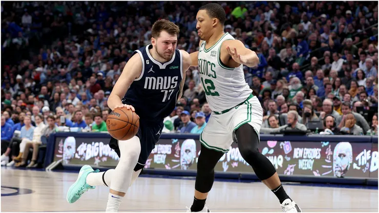 Luka Doncic #77 of the Dallas Mavericks drives to the basket against Grant Williams #12 of the Boston Celtics
