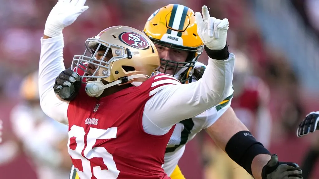 Drake Jackson #95 of the San Francisco 49ers rushes up against Royce Newman #70 of the Green Bay Packers – Thearon W. Henderson/Getty Images