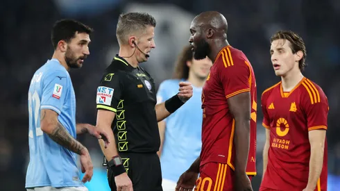 Romelu Lukaku of AS Roma speaks with match referee Daniele Orsato during the Coppa Italia match between SS Lazio and AS Roma at Stadio Olimpico on January 10, 2024 in Rome, Italy.