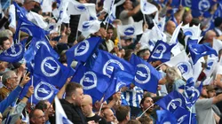 Brighton and Hove Albion fans wave flags as they show their support prior to the Premier League match between Brighton & Hove Albion and Watford at American Express Community Stadium on August 21, 2021 in Brighton, England. (Photo by Steve Bardens/Getty Images)