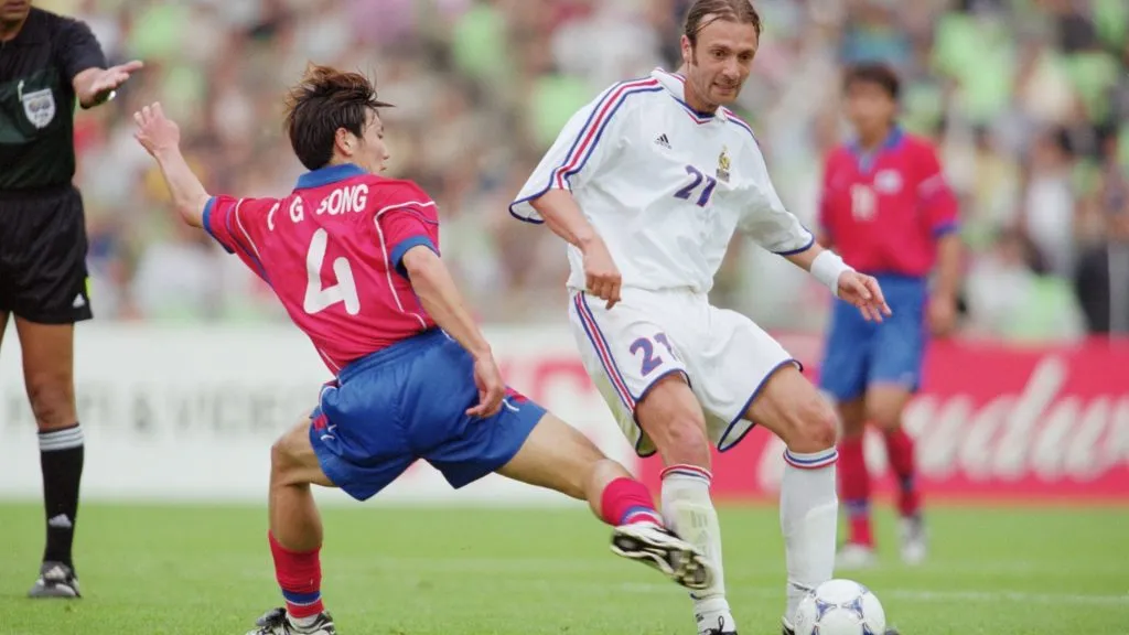 Christophe Dugarry of France is challenged by Chong Gug Song of Korea during the FIFA Confederations Cup match at the Daegu Sports Complex in Daegu, Korea. \ Mandatory Credit: Stanley Chou /Allsport
