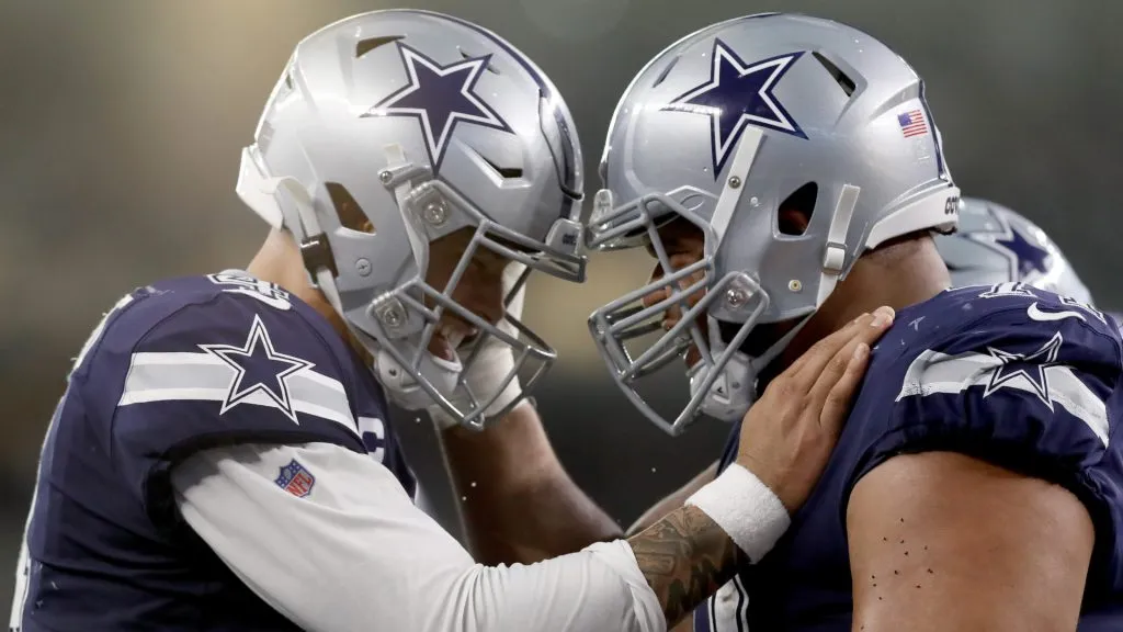 QB Dak Prescott celebrating with OL La'el Collins