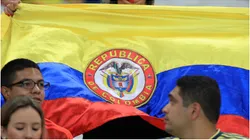 A fan of Colombia shows a Colombian flag