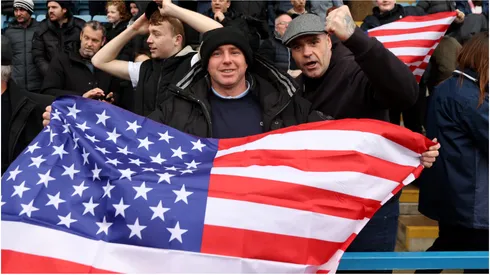Fans display a USA flag