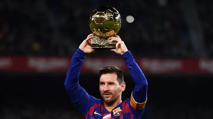 Lionel Messi of FC Barcelona holds up his sixth Ballon d'Or prior to the Liga match between FC Barcelona and RCD Mallorca at Camp Nou on December 07, 2019 in Barcelona, Spain.