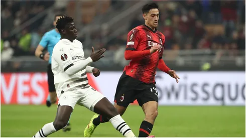 Tijjani Reijnders of AC Milan is tackled by Mahamadou Nagida of Stade Rennais