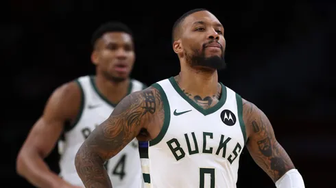 Giannis Antetokounmpo #34 and Damian Lillard #0 of the Milwaukee Bucks look on against the Washington Wizards at Capital One Arena on November 20, 2023 in Washington, DC.