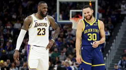 LeBron James and Stephen Curry laughing during a game.