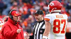 Kansas City Chiefs head coach Andy Reid speaks with Travis Kelce #87 during the second half against the Denver Broncos at Empower Field At Mile High on January 08, 2022 in Denver, Colorado.